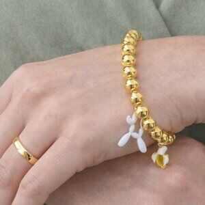 18K gold-plated copper bracelets with banana and  dog charms.